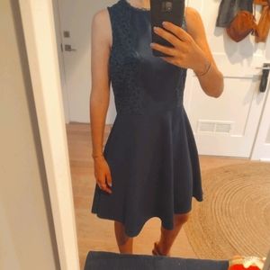 A-line deep teal green dress with lace details